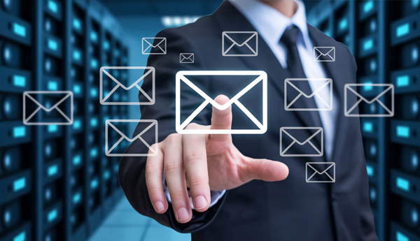 Image of a person pointing to and touching a virtual email envelope.