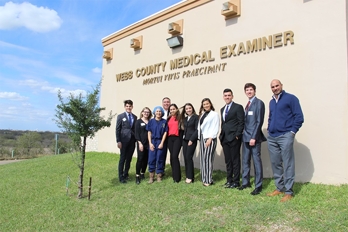 Students from United High School in Webb County with County Judge Tano Tijerina in front of the medical examiner's office