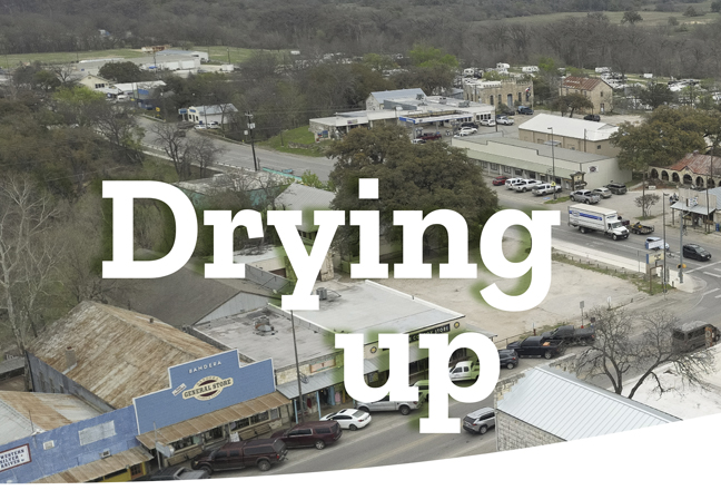 Aerial view of a town and the words "Drying up" on the picture