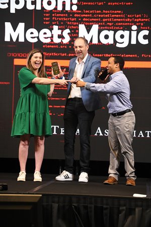 Person performing magic with technology on stage