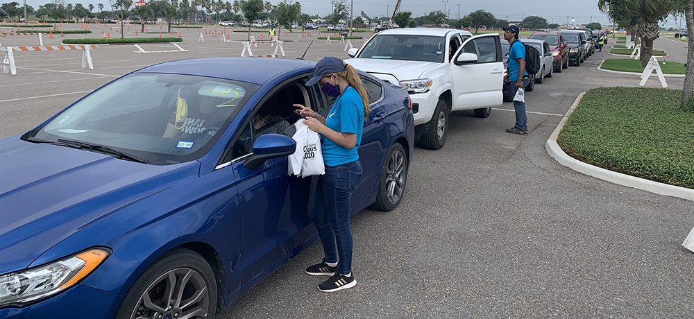 Hidalgo County census employees register people for the 2020 census during a food drive in Edinburg, Texas.