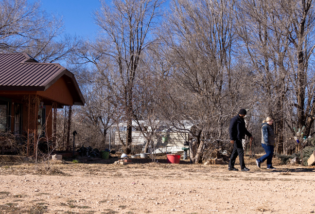 Hockley County Sheriff's Deputy Brandon Lewis and Crisis Worker Abigale Blasingame walking outside