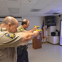 Image of two officers practicing their aim