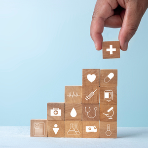 Stacks of wooden blocks with different medical icons on them