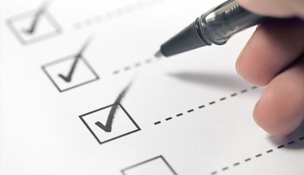 Person checking off boxes in a list