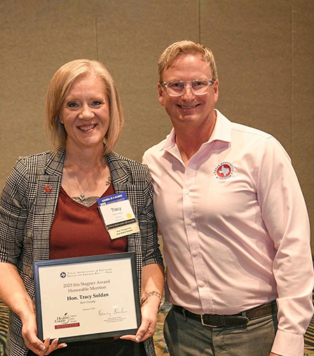 Kerr County Treasurer Tracy Soldan poses with TAC HEBP Wellness Consultant Mark Zollitsch during 2023 Healthy County Boot Camp