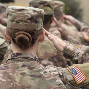 Military personnel saluting