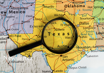 Magnifying glass over Texas on a map